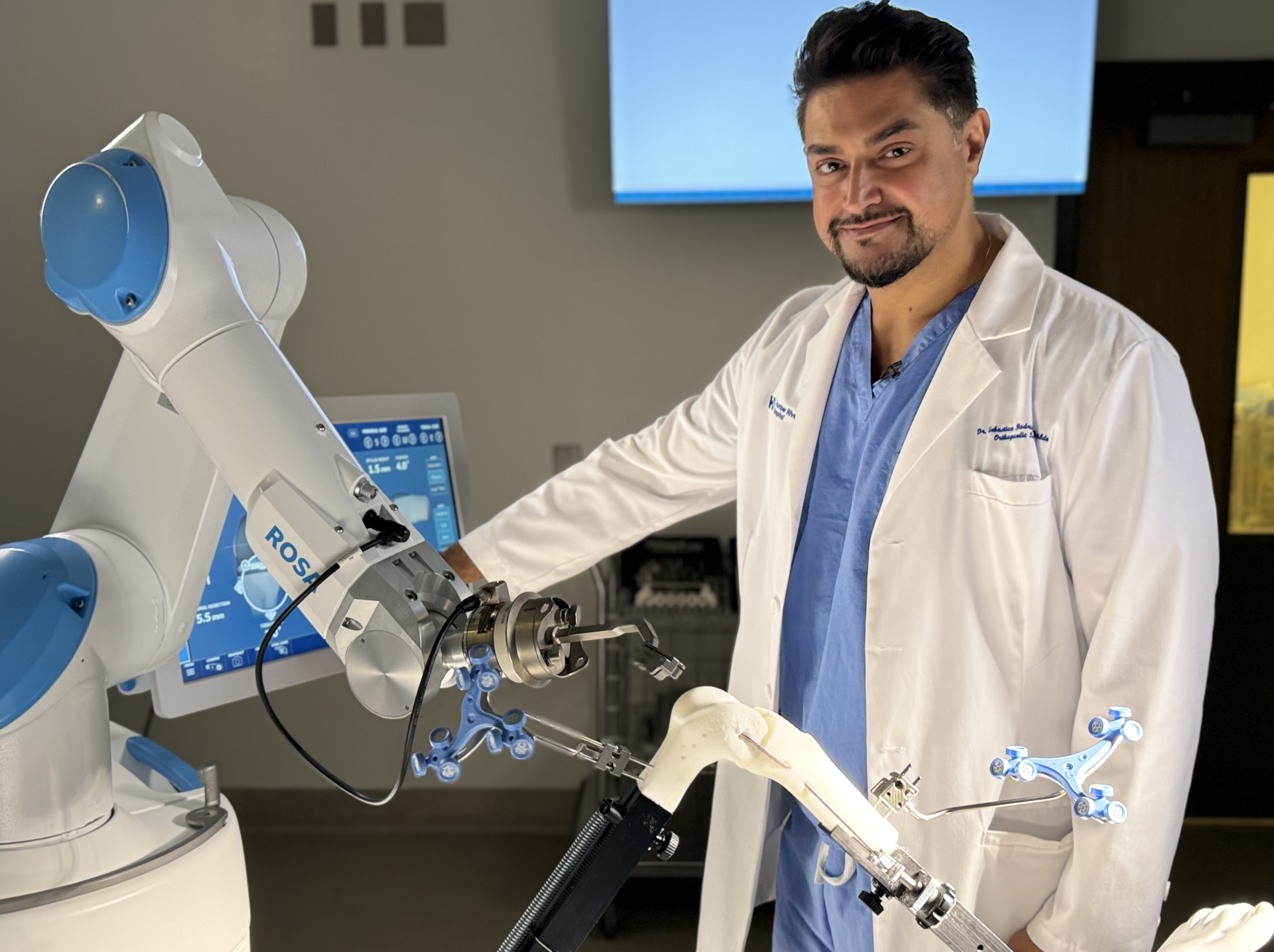 Dr. Rodriguez-Elizalde with the ROSA robotic surgical system
